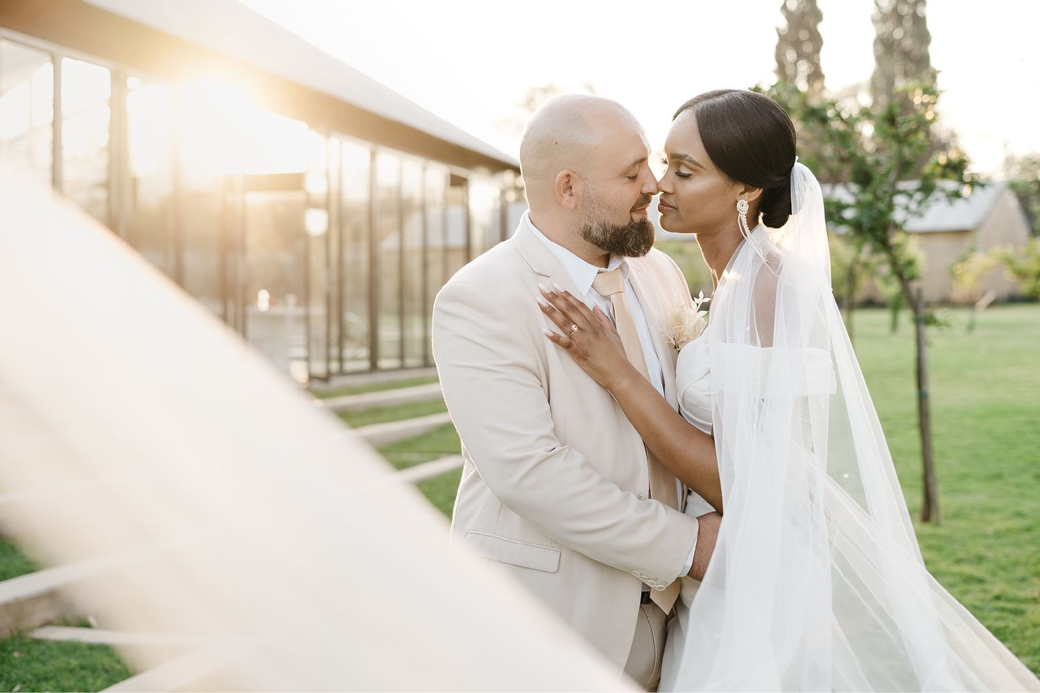 bride and groom at beautiful pool looking timeless and romantic on their wedding day at De Harte in South Africa