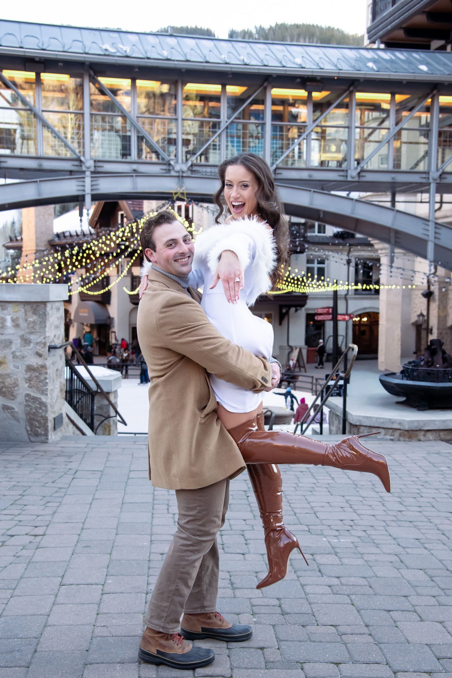 Cute and fashionable engagement photo session in Lionshead Village Vail Colorado after a winter proposal