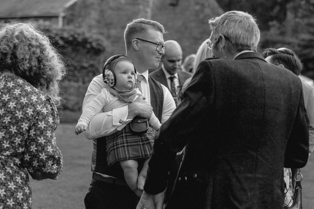 A series of black and white photographs showing couples dancing together at an outdoor event.