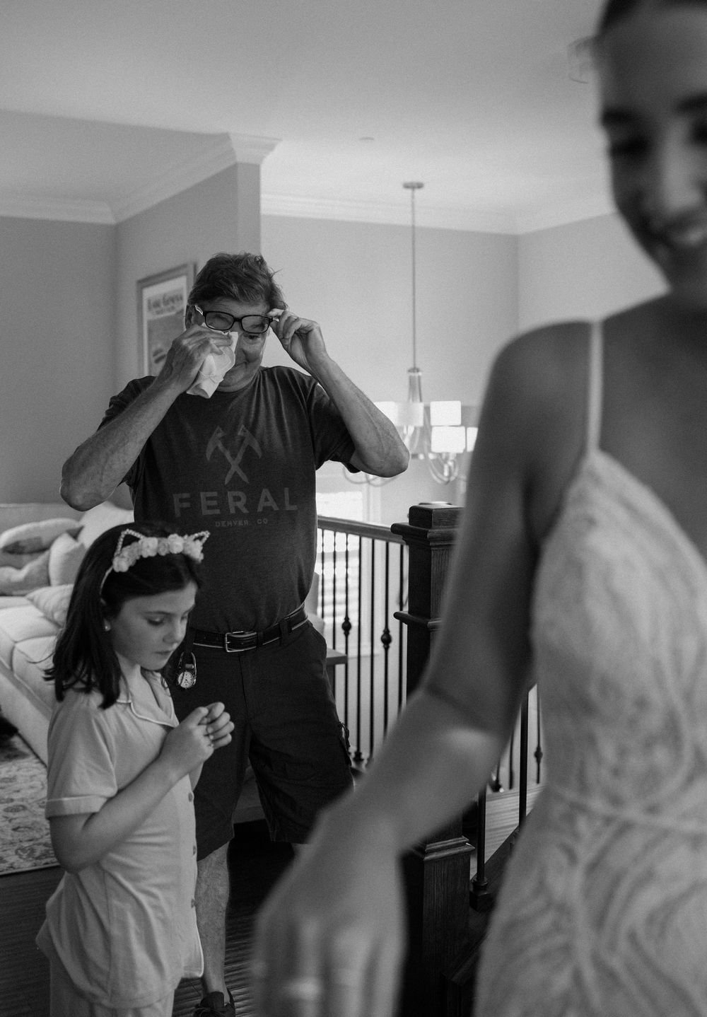 Wedding preparation scene showing people getting ready in a bright indoor space.