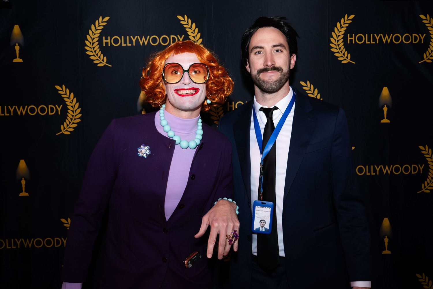 Two party attendees show off their halloween costumes at a late night event