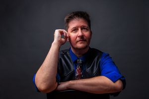 Portrait series showing contemplative poses against dark studio backdrop. portrait photography st louis.