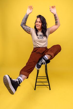 Dynamic sequence of person in brown pants falling off chair against yellow background. portrait photography st louis.
