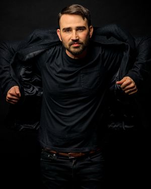 Dramatic black on black fashion poses showing movement in dark clothing. portrait photography st louis.