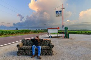 Rural landscape panorama showing farmland and a gas station under a cloudy sunset sky.  photography st louis.
