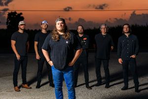 Group photo sequence showing people posing together against orange sunset sky. live event photography st louis.