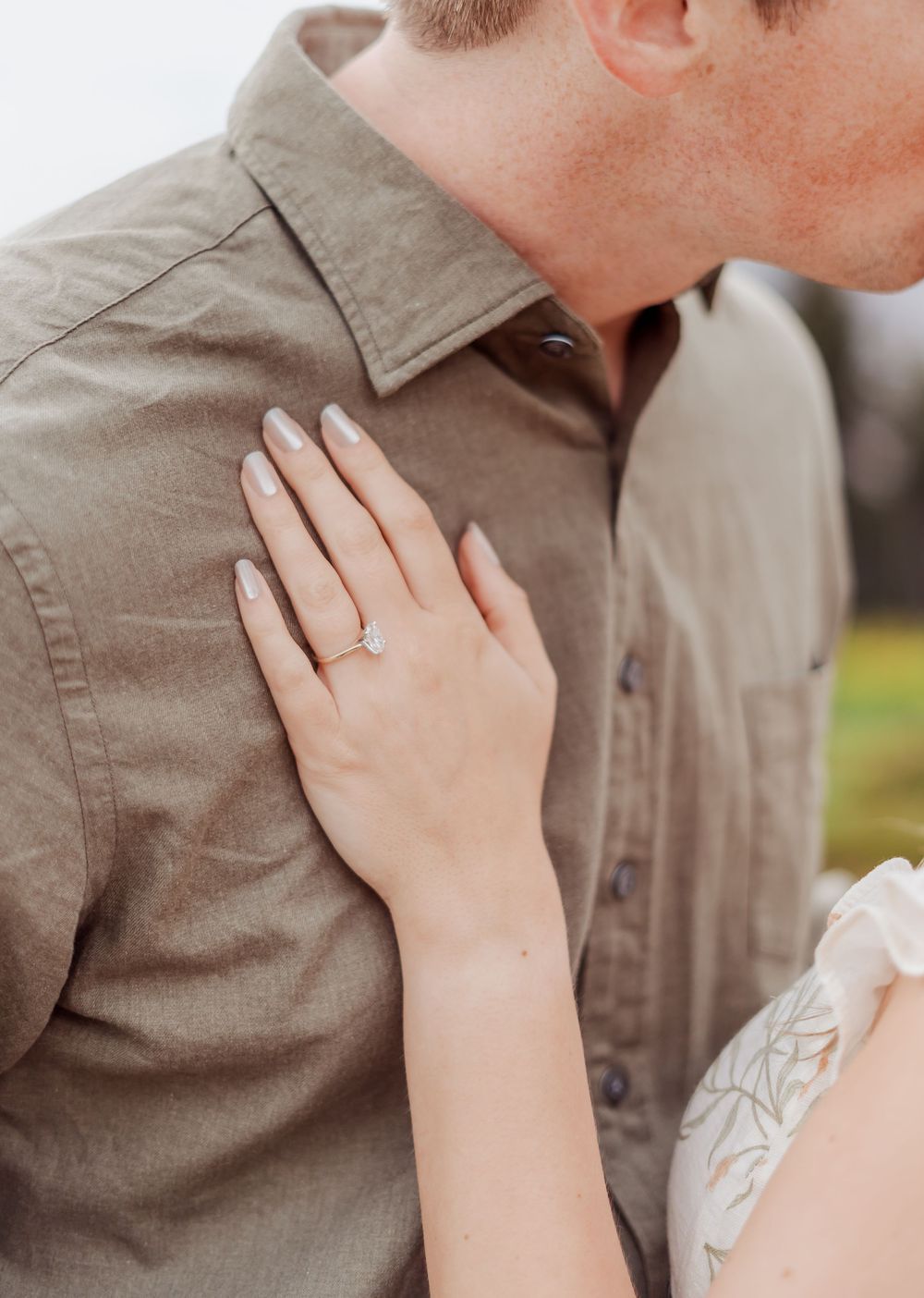 Close-up series of romantic engagement photos showing a couple embracing while wearing casual attire outdoors with the engagement ring.