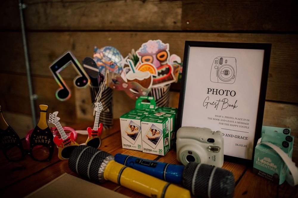 Vintage decorative items including a photo frame, musical note, and colorful ornaments arranged on a wooden surface.