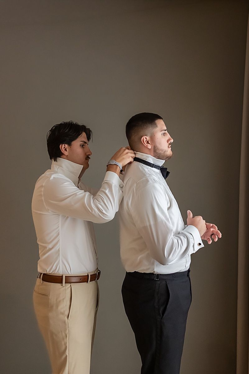 A sequence of photos showing someone helping another person adjust their formal attire against a dark background.