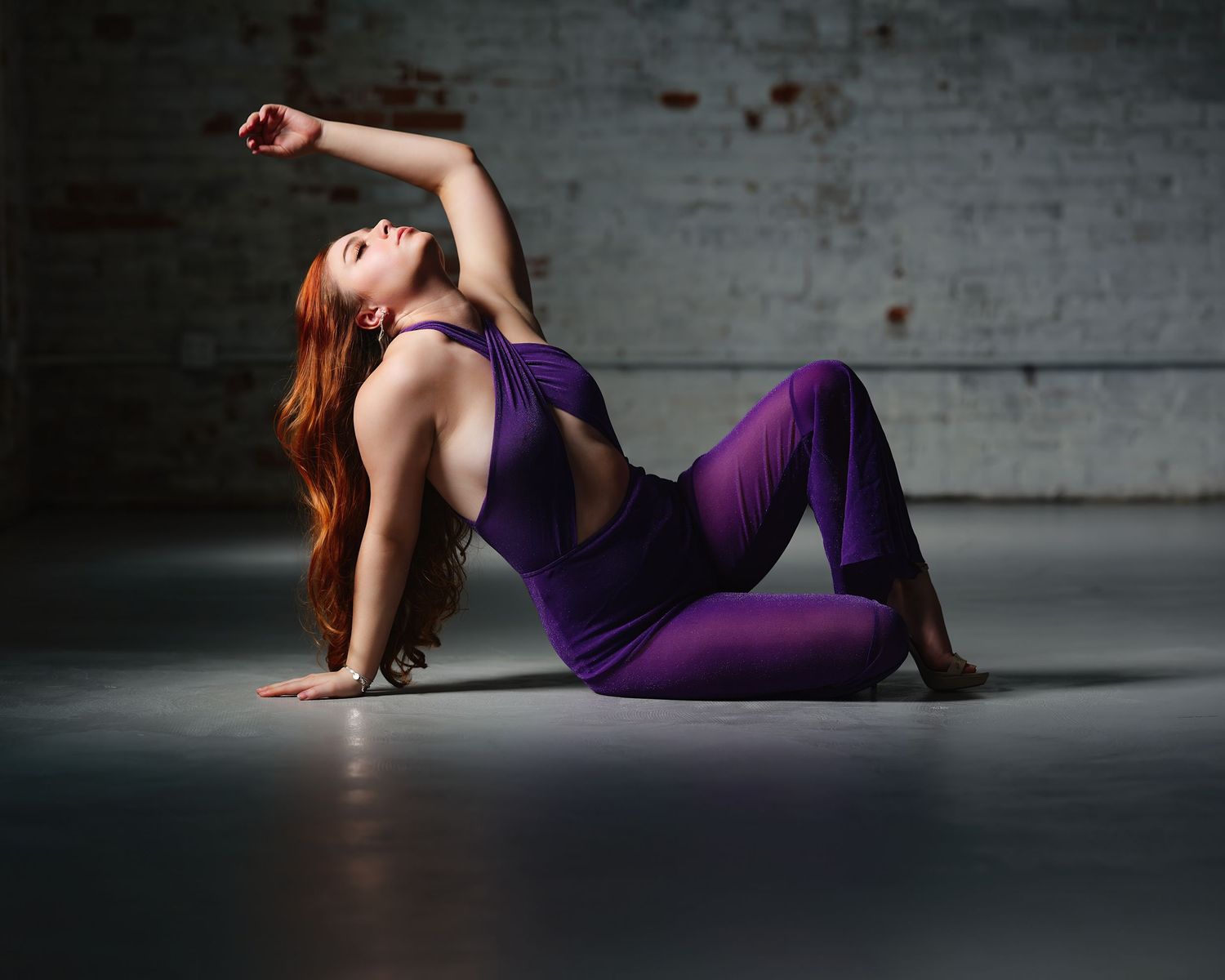 David G Holt Photography - Dramatic photo series of a woman in purple dress posing gracefully on a studio floor.