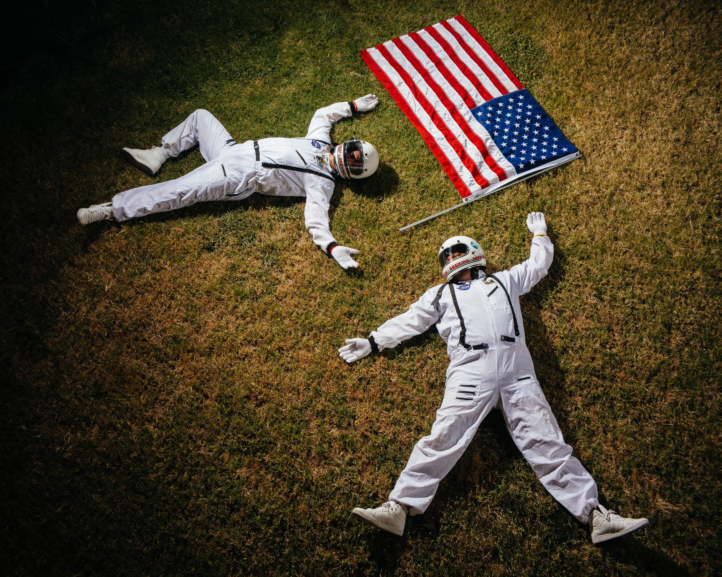 Astronaut in white spacesuit lying on grass with American flag in creative photo sequence composition.