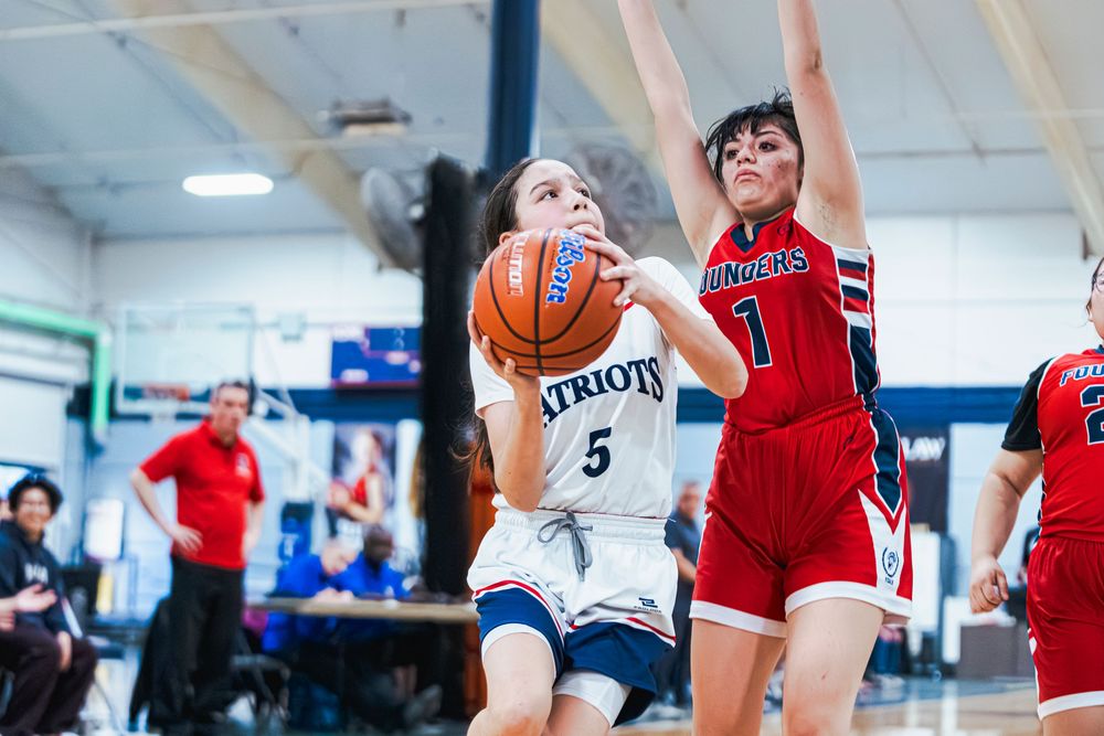 Girls Basketball player moments before jumping up for a layup