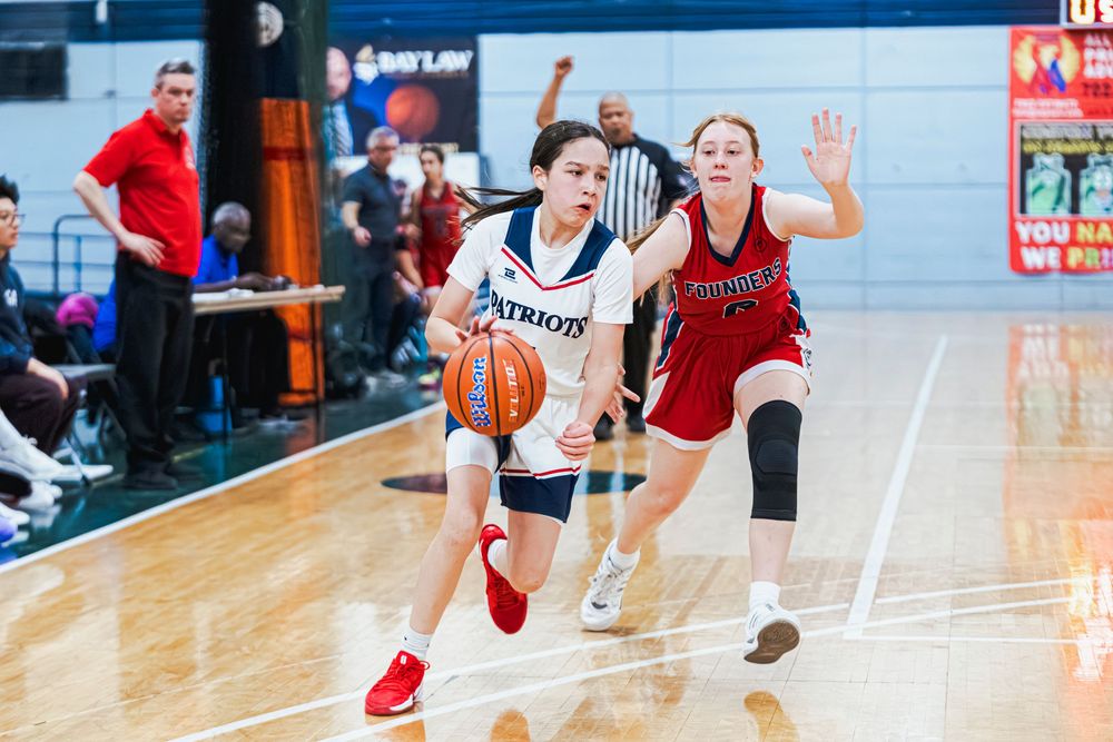 Girls Basketball player running towards the camera with the call