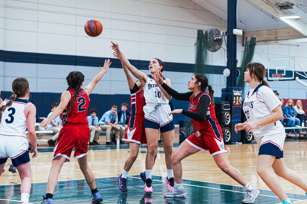 Girls Basketball player shooting shot from the free throw line