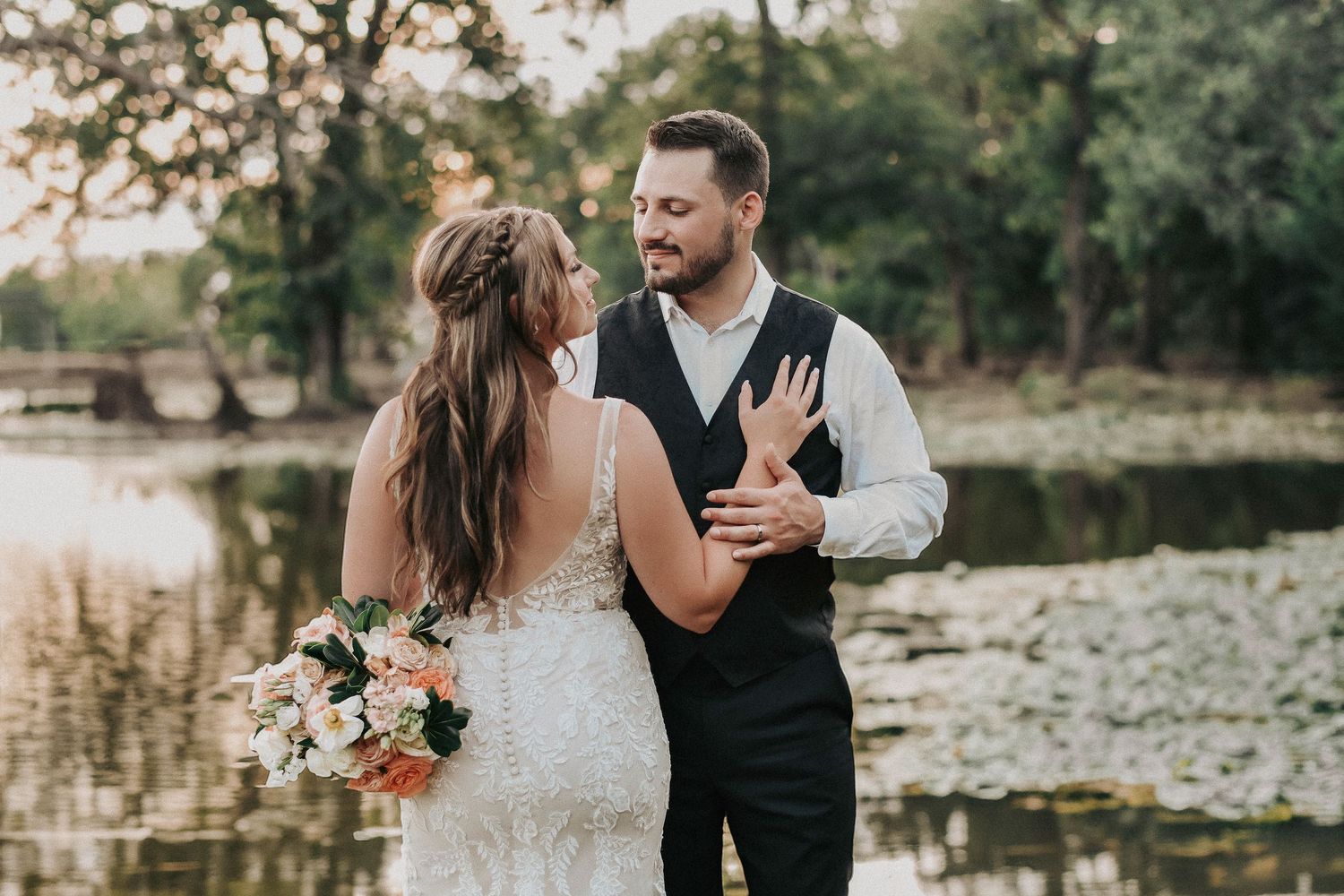 Bride and groom sharing a quiet, romantic moment during their spring wedding at Towering Oaks Wedding Venue.