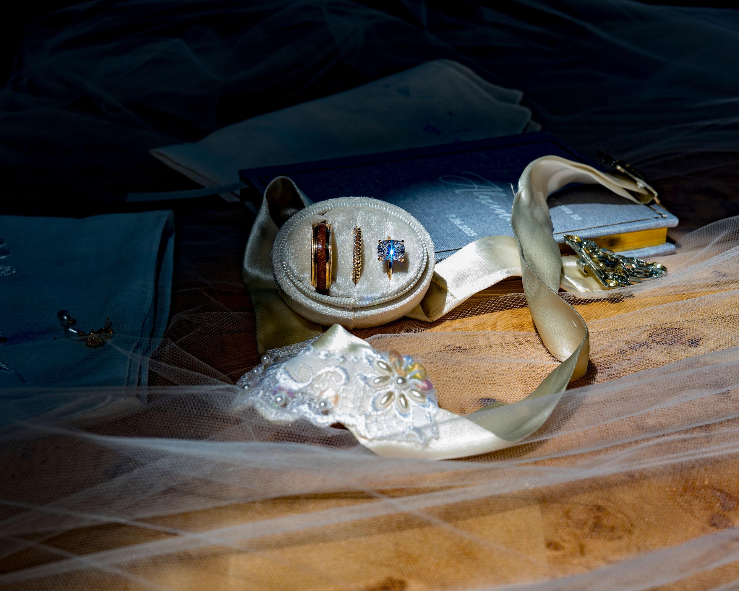A series of connected images showing white flour being mixed on a wooden surface in dim lighting.