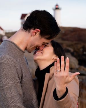 Engagement portrait captured by a Seacoast Maine, NH, MA, and Portsmouth New Hampshire wedding photographer. Nubble Lighthouse, York, Maine