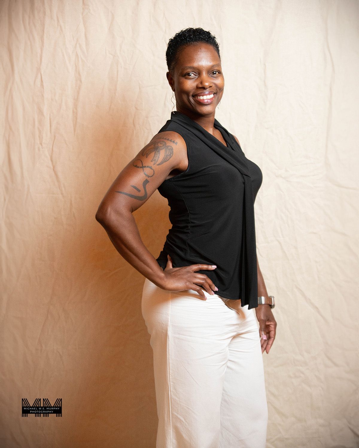 A person wearing a brown shirt and checkered jacket poses against a dark background in a series of headshots.