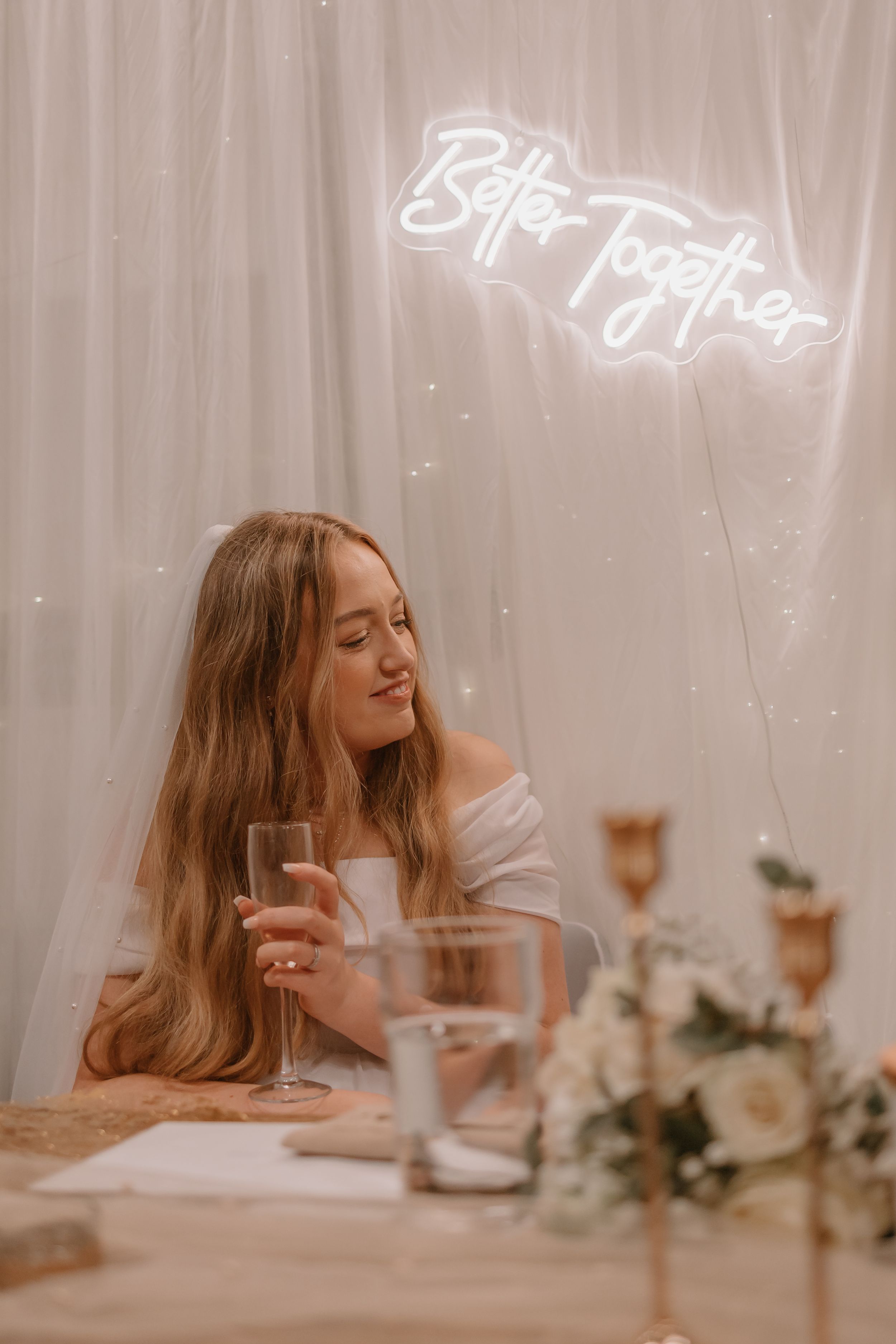 Dreamy sequence of a Bride resting at a table with romantic floral decor and soft lighting.