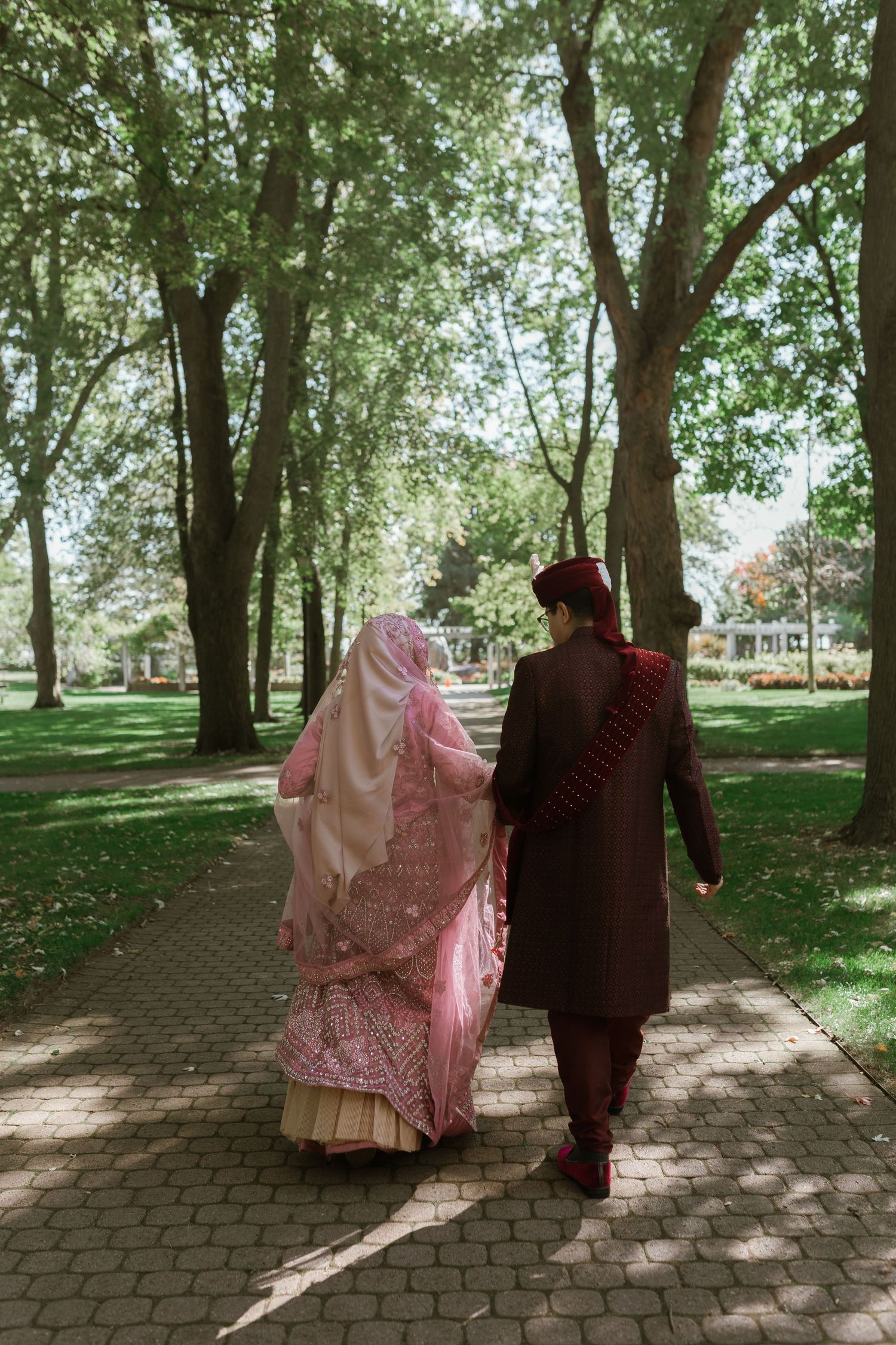 Bride and groom sharing a joyful moment on their wedding day, surrounded by elegant decor and loved ones.
