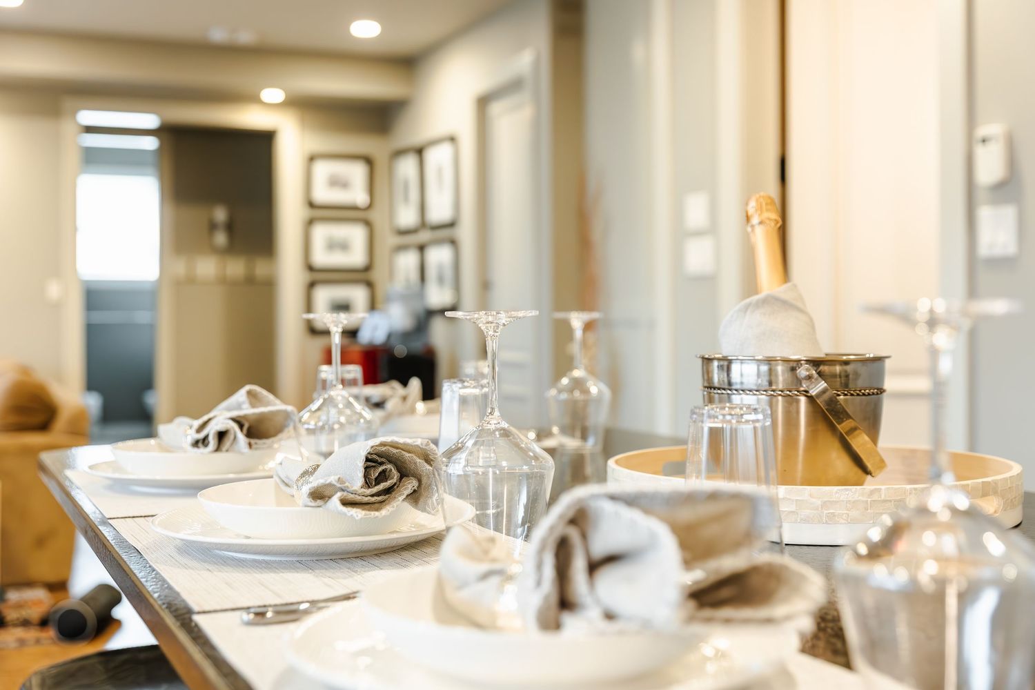 Elegant  interior airbnb photo's, place settings and recessed lighting creates an upscale dining atmosphere in Kelowna BC