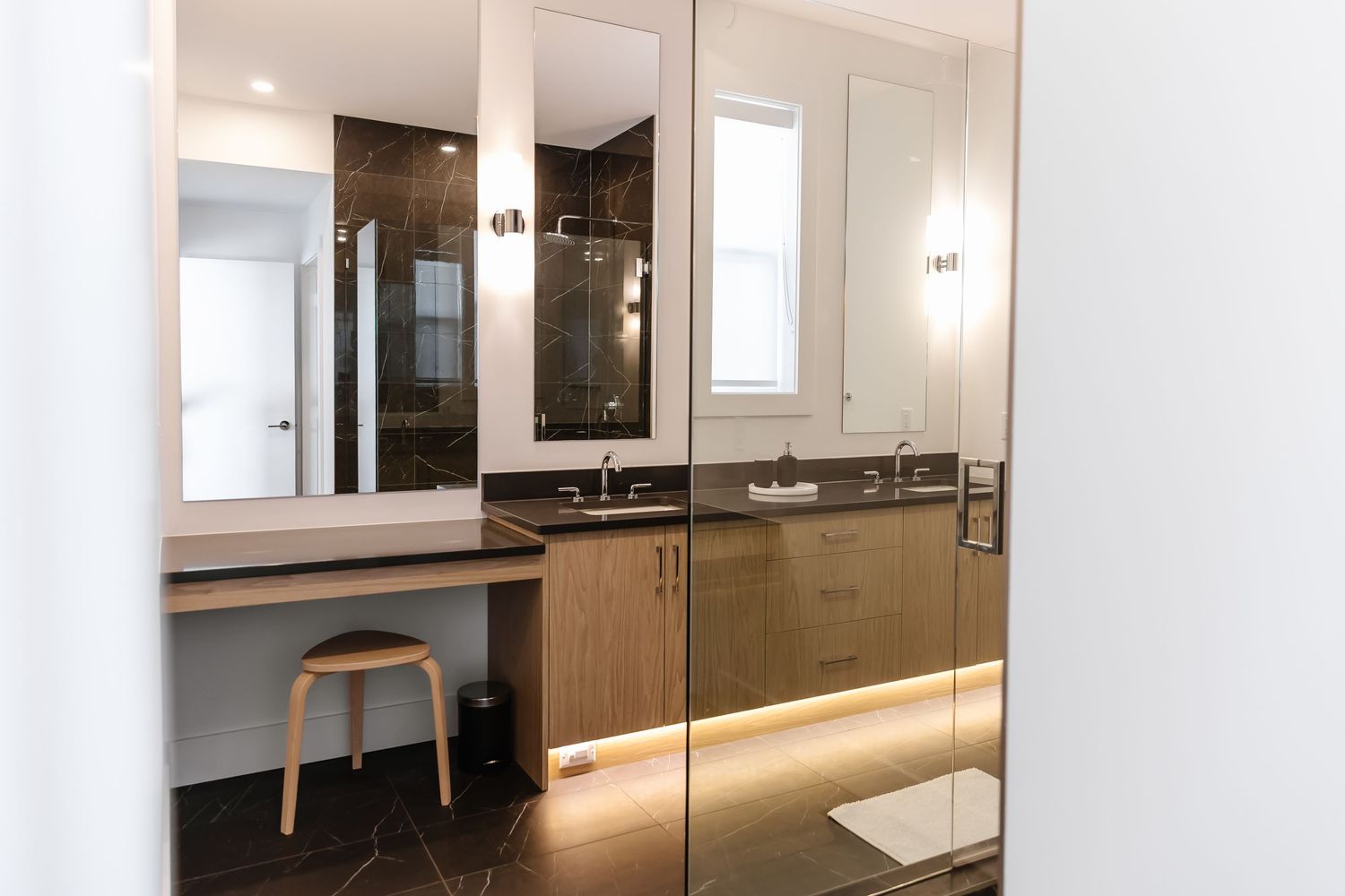 Bright modern living area with built-in storage and ambient lighting.