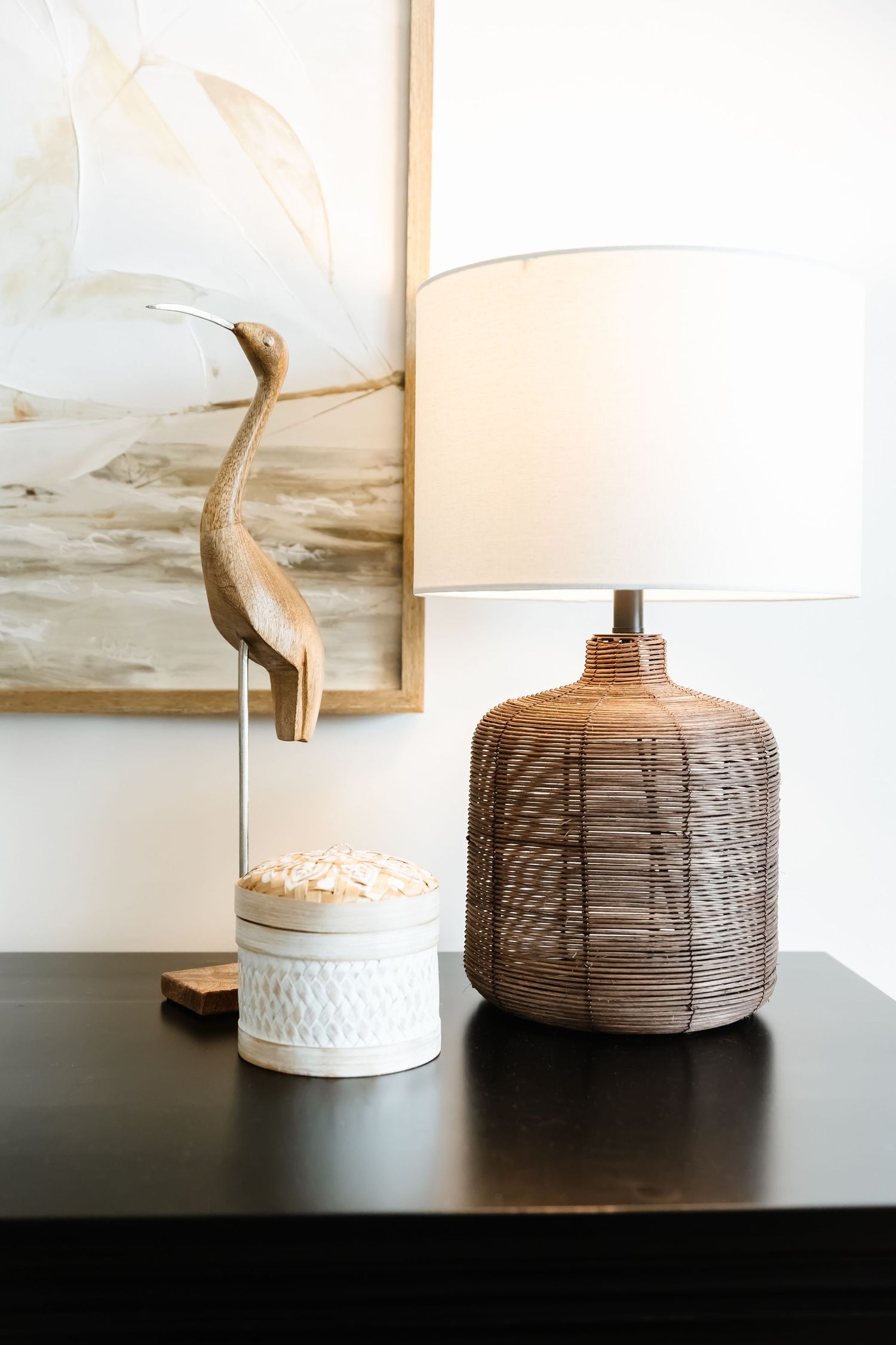 Collection of decorative table lamps with textured bases and white shades on a dark surface in a west Kelowna Airbnb