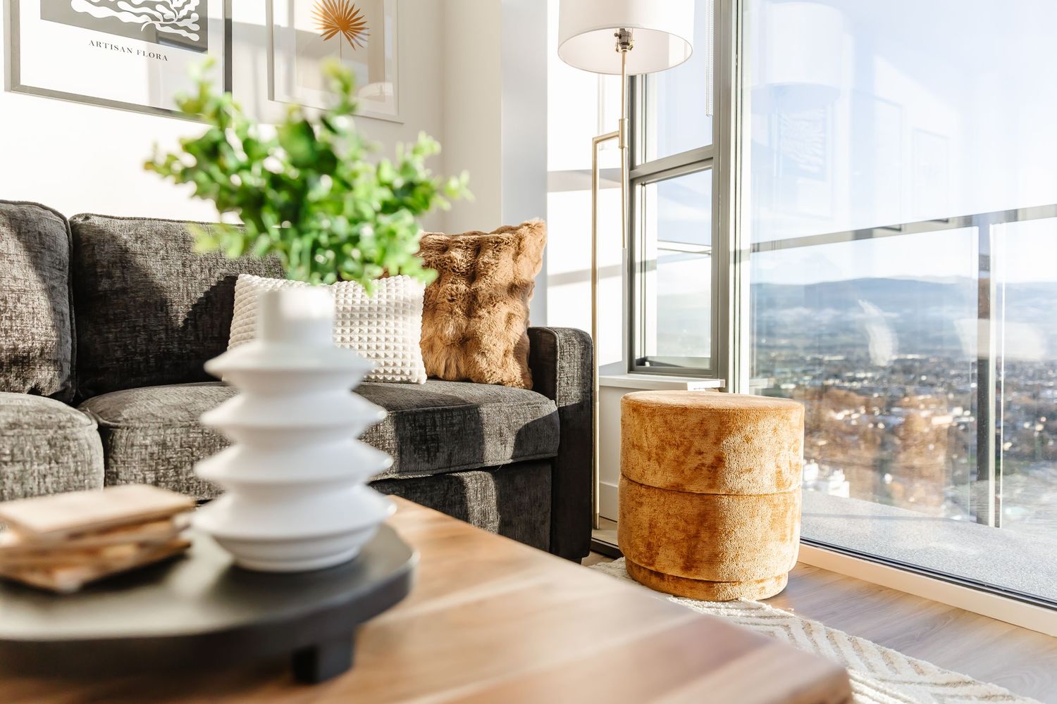 Modern dining area with panoramic windows and contemporary furniture.