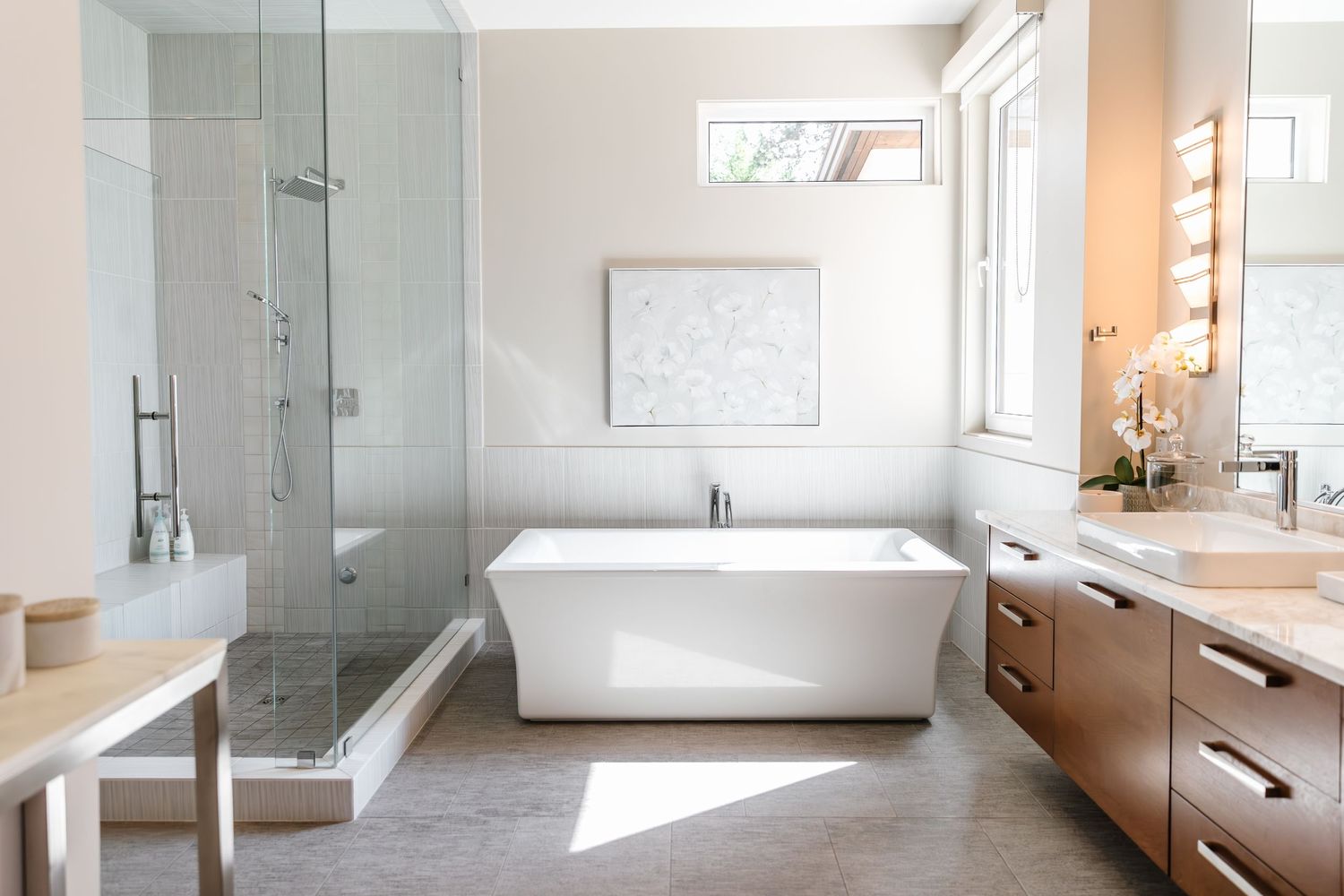 Modern bathroom featuring glass shower enclosure, floating vanity, and clean lines throughout.