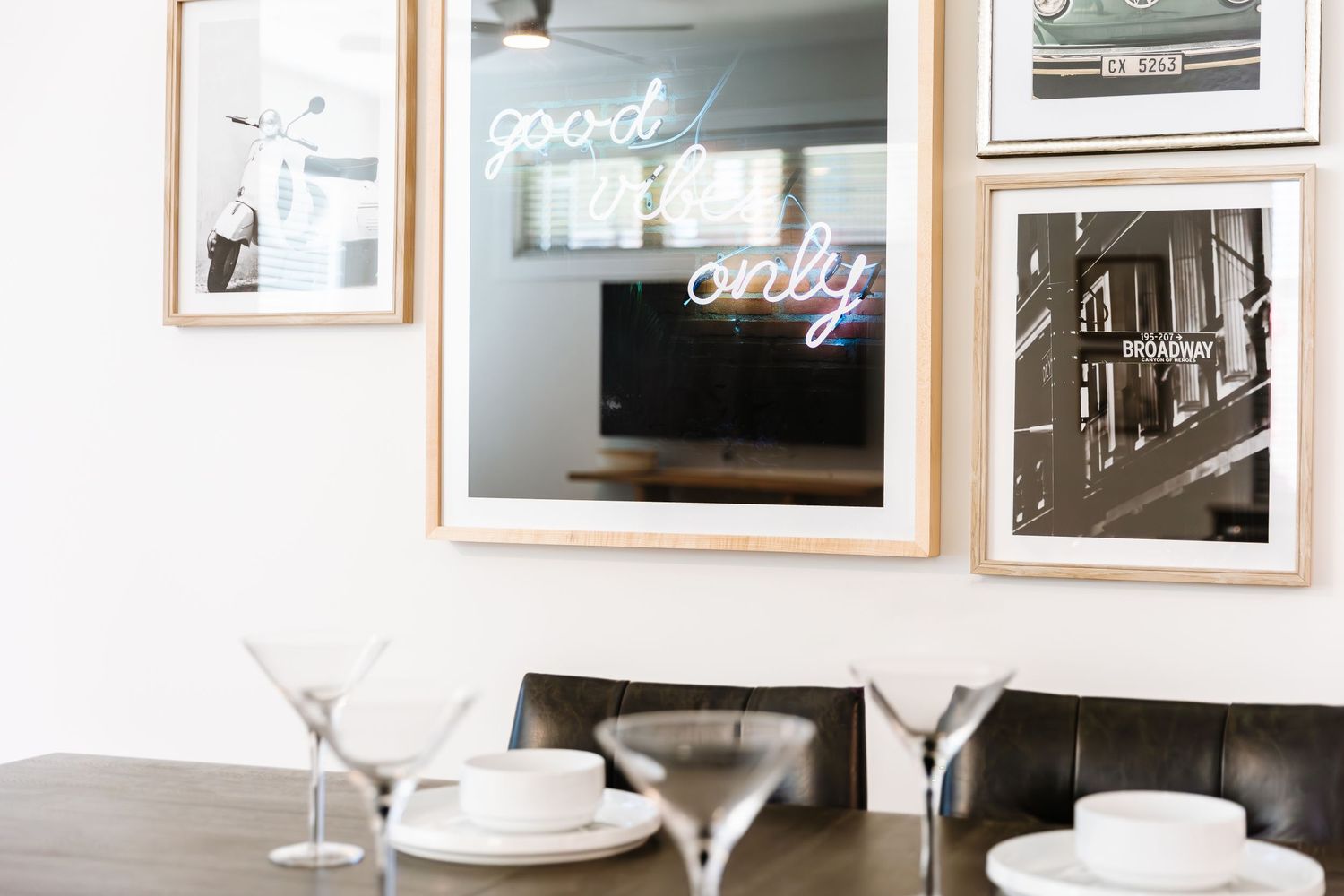 Elegant dining space with white walls and artistic decor.