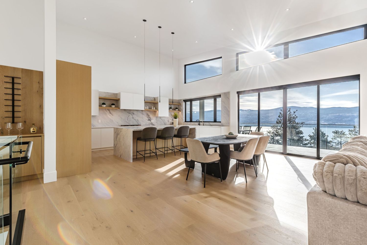 Panoramic 360-degree view of a modern luxury apartment interior with floor-to-ceiling windows and mountain views.