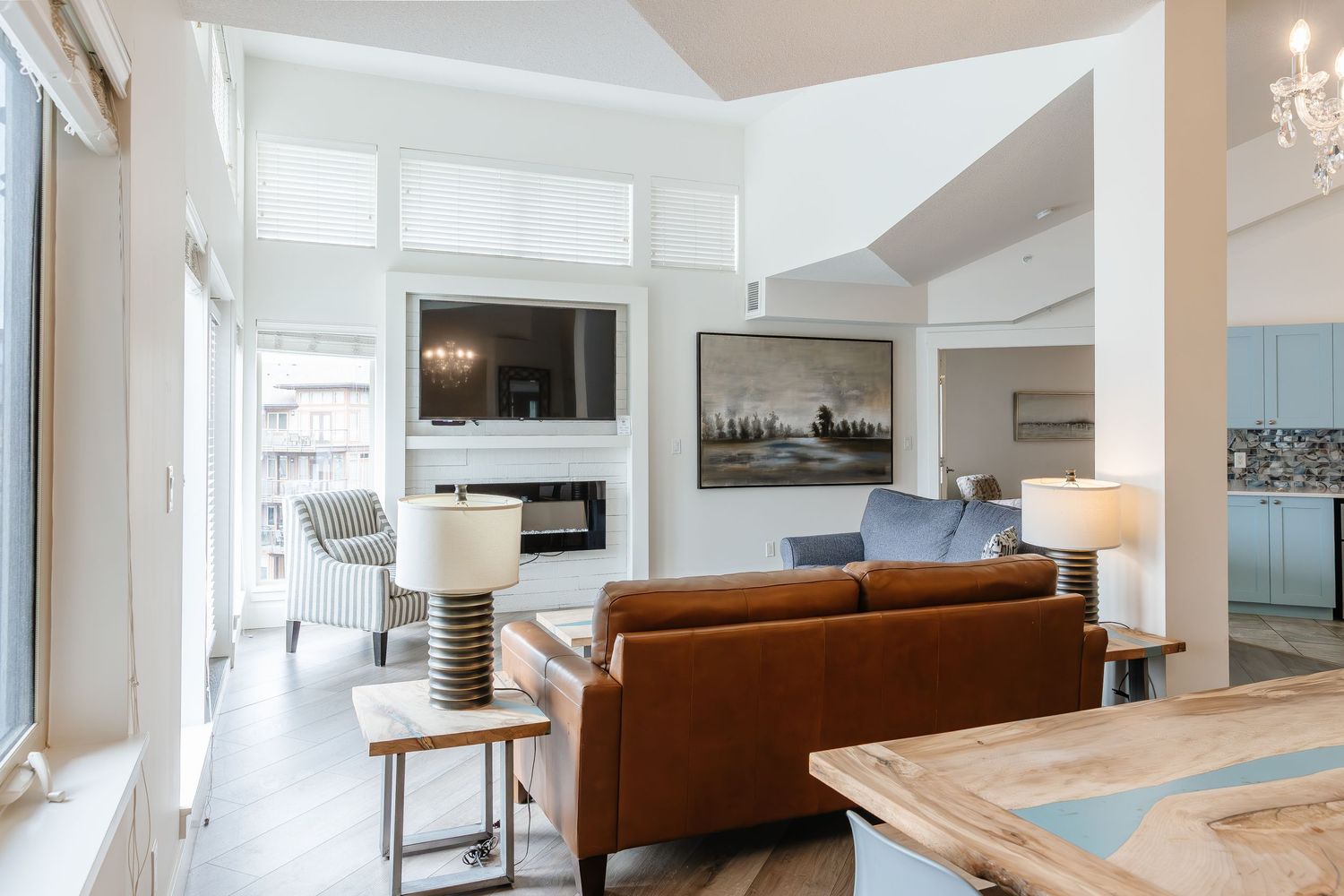 Open concept living space with high ceilings and modern furnishings in a west Kelowna Airbnb
