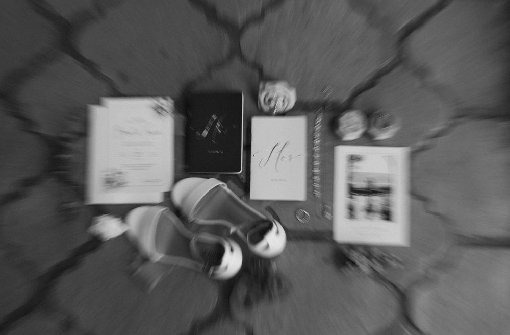 Wedding stationery and invitation suite arranged artistically in black and white.