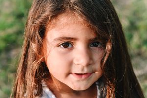 Close up portrait of a young child with natural sunlight.