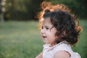 Natural outdoor portrait with soft sunlight and bokeh background.
