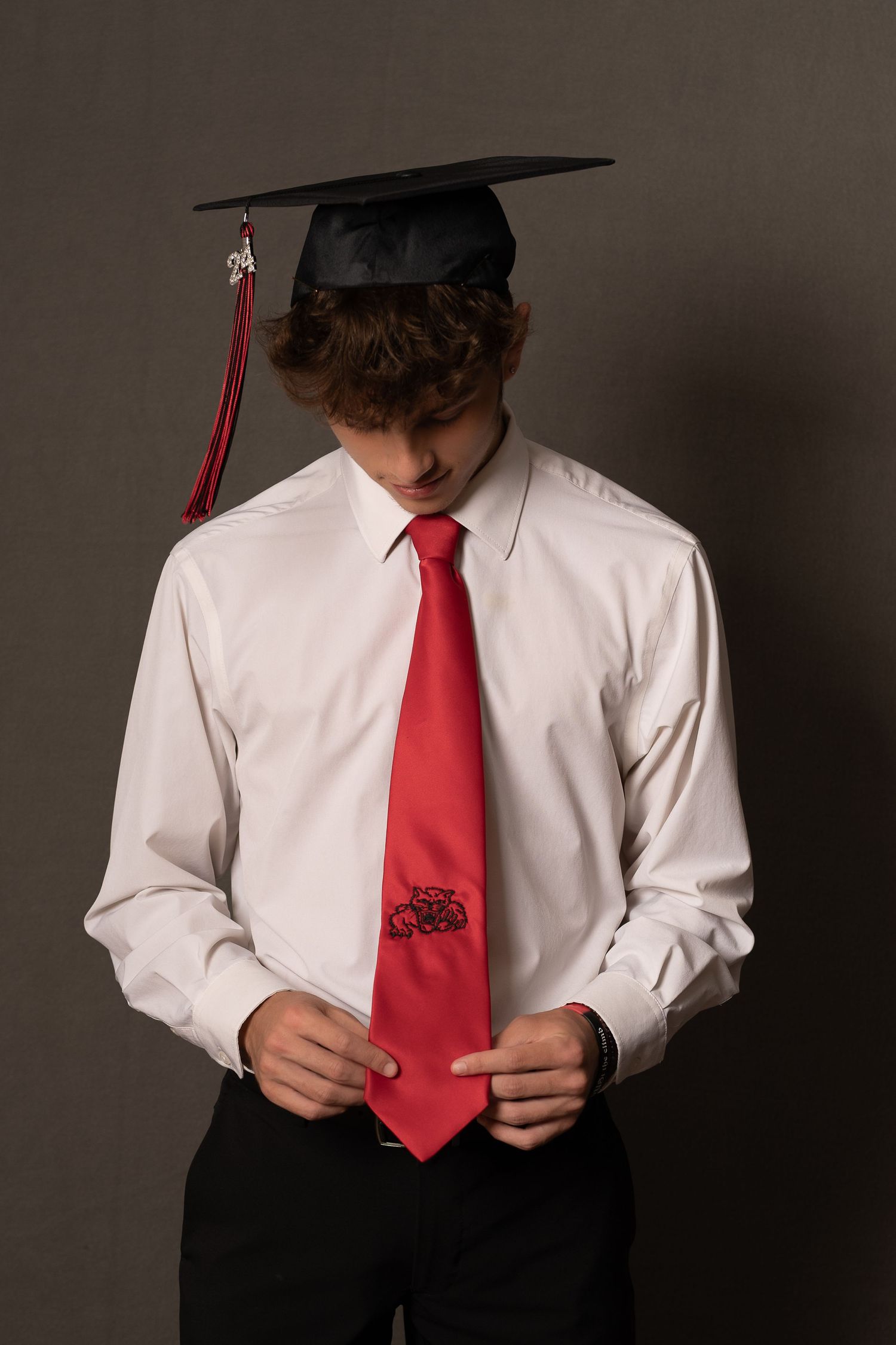 Strurther's grad wearing his dad's tie and following in his dad's footsteps. On his way to becoming a teacher!