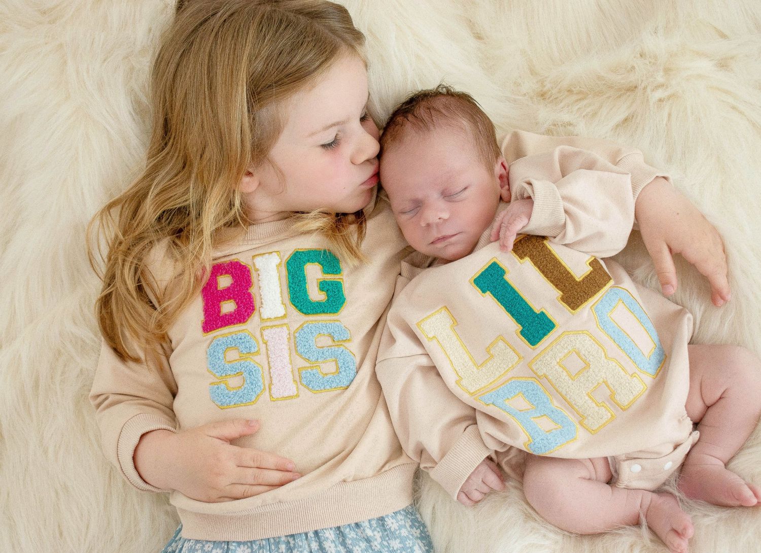 Baby milestone photo series with colorful letter blocks showing growth progression.