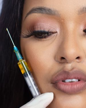Close-up beauty shot showing cosmetic injection procedure.