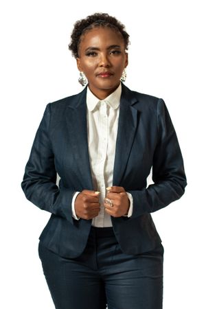 Professional studio shot in navy business suit with white button-up shirt.