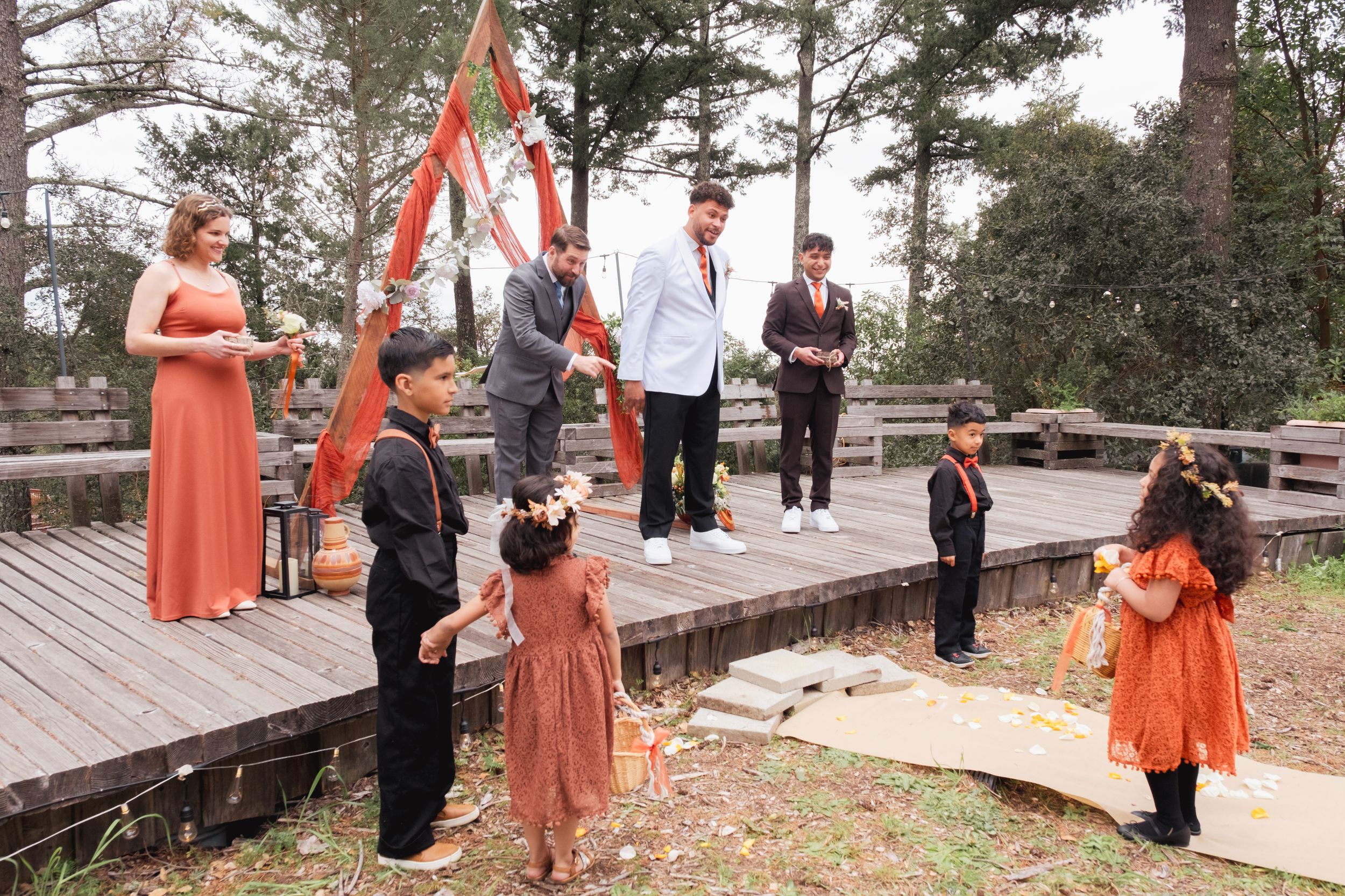 Flower girl and kids dropping flowers.