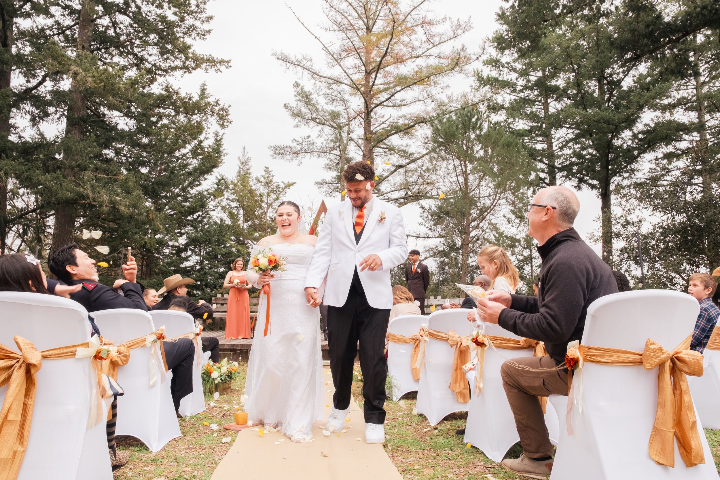 Couple walking down the aisle.