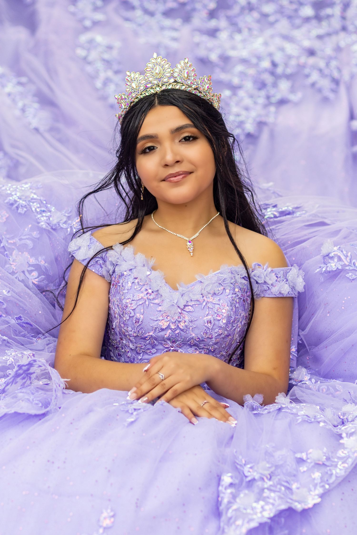 Beautiful Quinceañera wearing an elegant purple gown, celebrating her special 15th xv birthday with stunning quinceañera photography