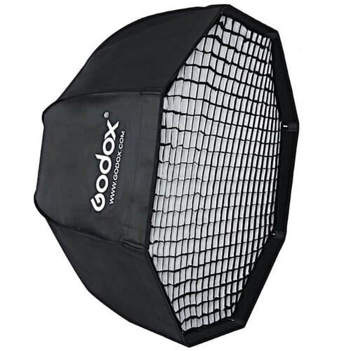 Multiple black octagonal softboxes with grid patterns shown at different angles against white background.