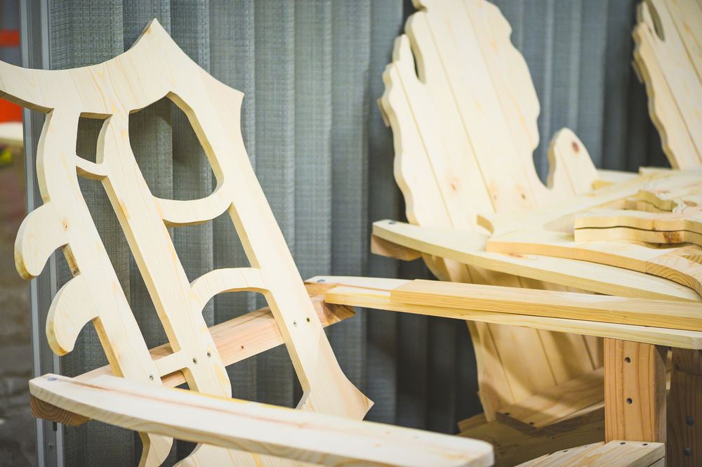 Ornate wooden chair back detail in process of being crafted.