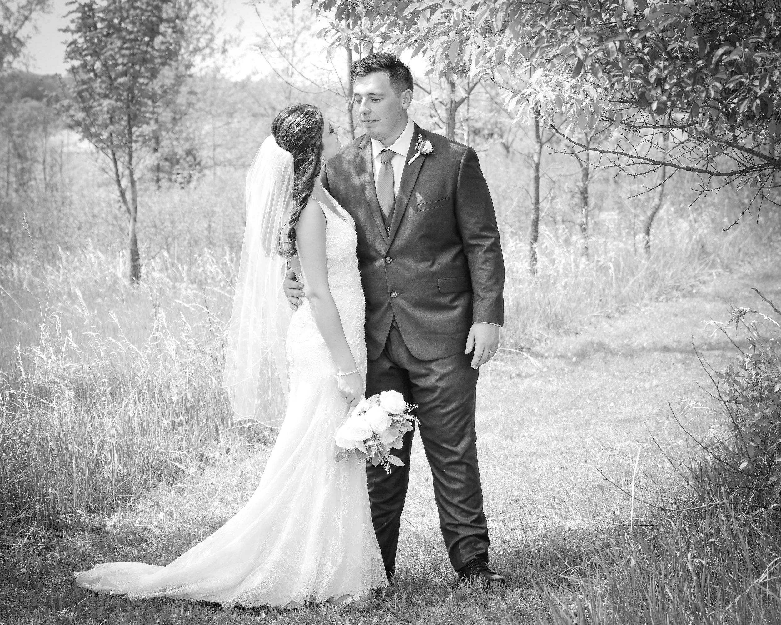 Romantic black and white wedding photos showing couples in outdoor garden settings.