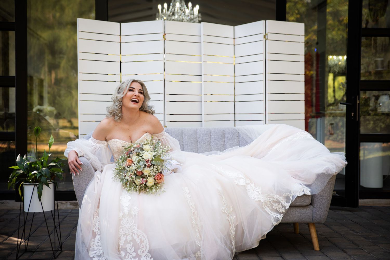 Bride portrait with bouquet during wedding preparation in Centurion with natural, elegant bridal styling
