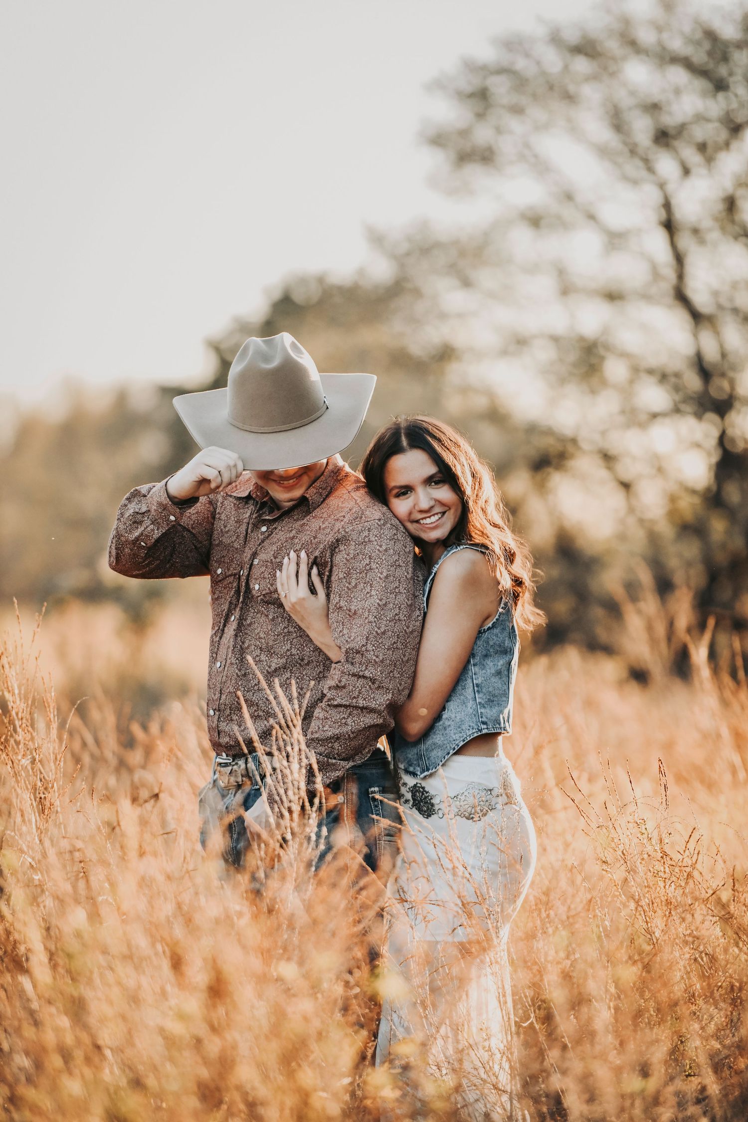 Texas rustic engagement photos during sunset in an open field
