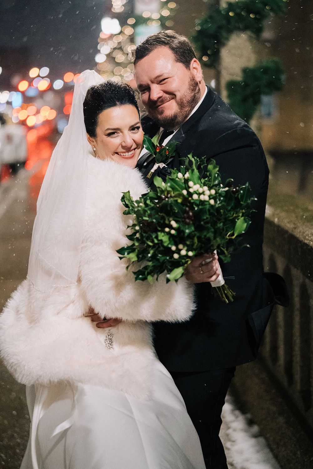 January wedding couple in the snow downtown Aurora, Illinois.