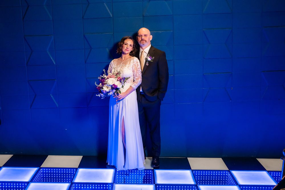 Portrait of couple with stage lighting at the Lyric Theater in Blue Island, Illinois.