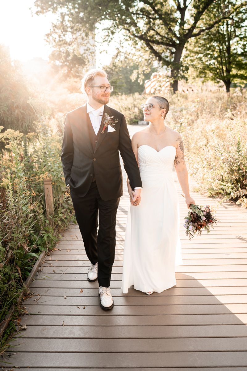 Summer portrait of wedding couple walking in the park in Chicago.